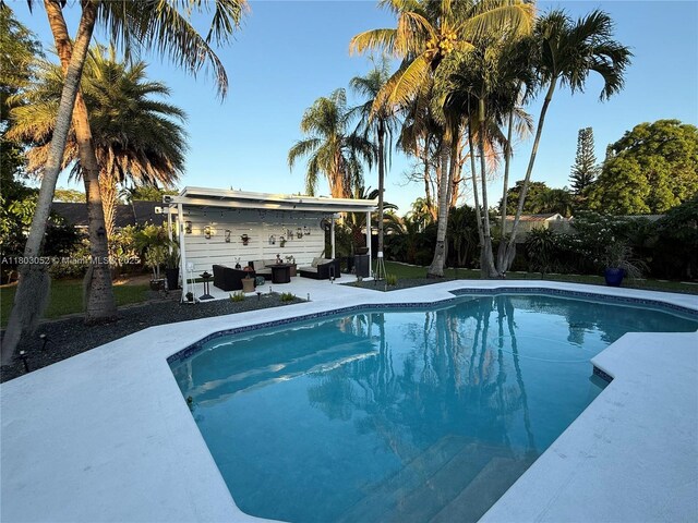 15223 SW 152nd Ave, Miami, FL 33187 - swimming pool with an outdoor hangout area and a patio