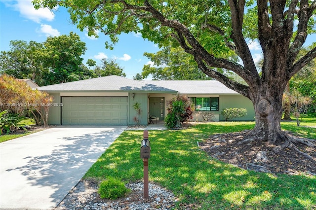 2394 NW 7th Ct, Delray Beach, FL 33445 - view of front facade featuring a garage, driveway, a front yard, and stucco siding
