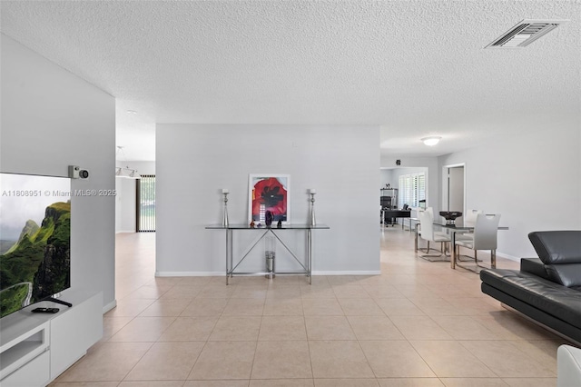 2394 NW 7th Ct, Delray Beach, FL 33445 - hallway featuring a textured ceiling and light tile patterned floors
