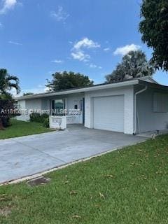 5710 NW 73rd Ave, Tamarac, FL 33321 - single story home with an attached garage, a front lawn, and concrete driveway