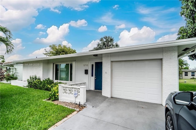 5710 NW 73rd Ave, Tamarac, FL 33321 - ranch-style home featuring brick siding, an attached garage, a front lawn, and driveway