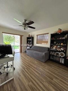 5710 NW 73rd Ave, Tamarac, FL 33321 - living area featuring wood finished floors, ceiling fan, and an office area