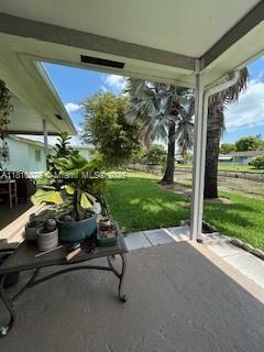5710 NW 73rd Ave, Tamarac, FL 33321 - view of patio / terrace