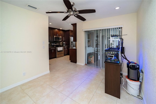 5710 NW 73rd Ave, Tamarac, FL 33321 - kitchen featuring stainless steel appliances, ceiling fan, dark brown cabinetry, recessed lighting, and light tile patterned floors