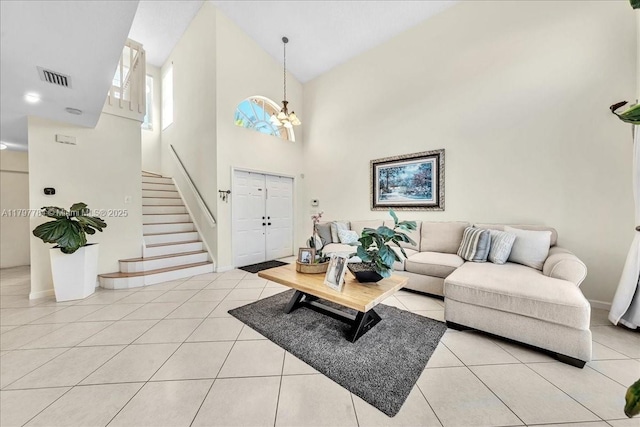 18018 SW 30th Ct, Miramar, FL 33029 - living area with high vaulted ceiling, stairway, light tile patterned floors, and a chandelier