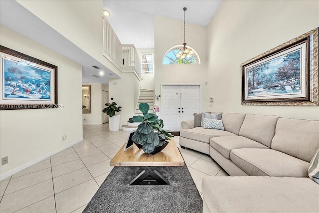 18018 SW 30th Ct, Miramar, FL 33029 - living area featuring stairs, light tile patterned floors, a high ceiling, and a chandelier
