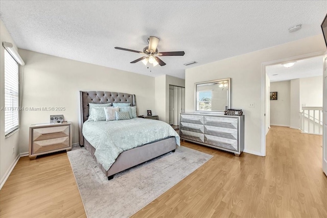 18018 SW 30th Ct, Miramar, FL 33029 - bedroom featuring light wood-type flooring, ceiling fan, and a textured ceiling