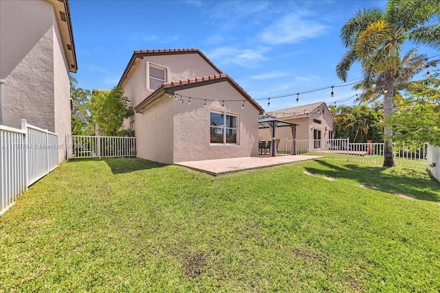 18018 SW 30th Ct, Miramar, FL 33029 - rear view of property with stucco siding, a fenced backyard, a patio area, and a tile roof