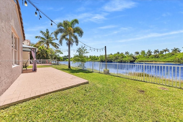 18018 SW 30th Ct, Miramar, FL 33029 - view of yard featuring a water view and a patio
