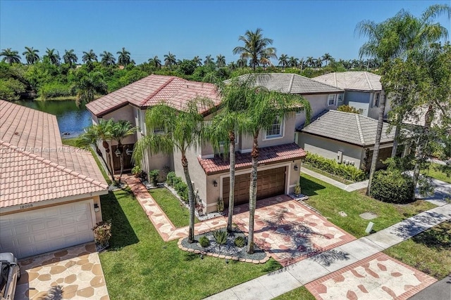 18018 SW 30th Ct, Miramar, FL 33029 - mediterranean / spanish home featuring a tiled roof, stucco siding, a front yard, and driveway