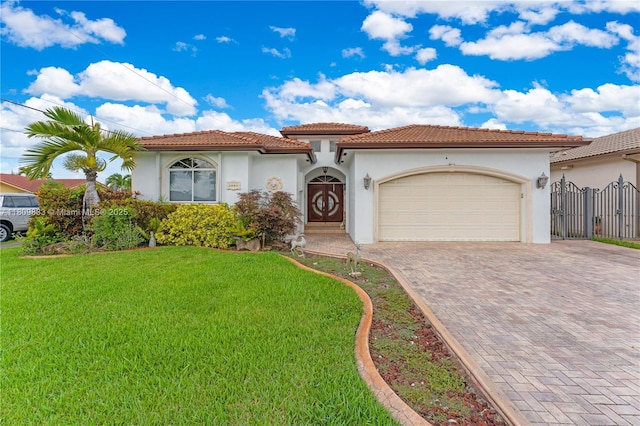 2801 SW 139th Ct, Miami, FL 33175 - mediterranean / spanish house with stucco siding, decorative driveway, a front lawn, and a garage