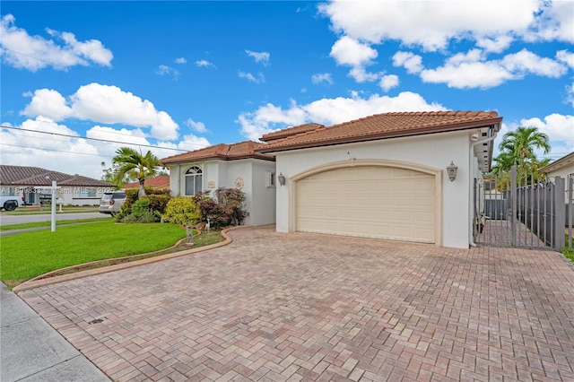 2801 SW 139th Ct, Miami, FL 33175 - mediterranean / spanish house featuring decorative driveway, stucco siding, a garage, and a tiled roof