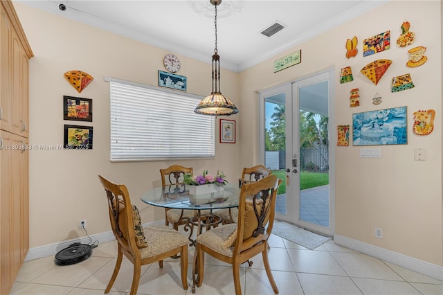 2801 SW 139th Ct, Miami, FL 33175 - dining area with french doors, light tile patterned flooring, crown molding, and baseboards