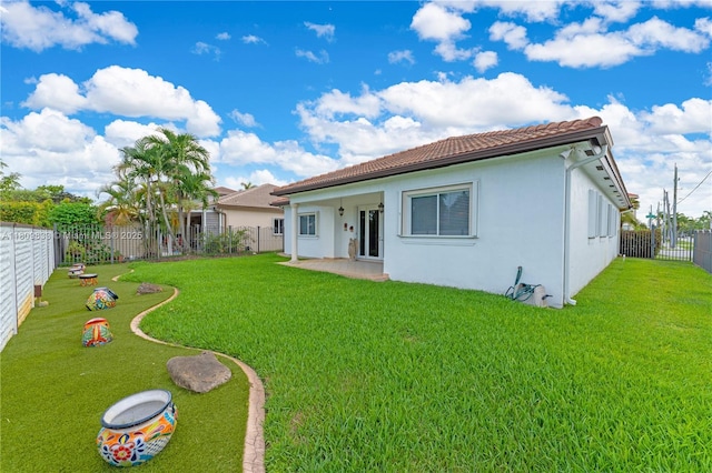2801 SW 139th Ct, Miami, FL 33175 - rear view of property with stucco siding, a tiled roof, and a patio