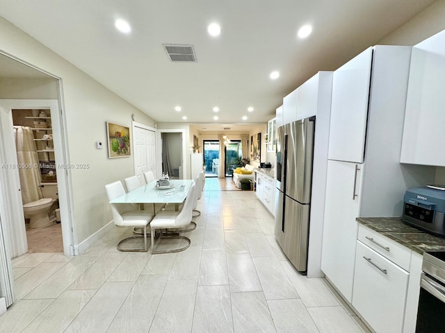 18830 NW 65th Ct, Hialeah, FL 33015 - kitchen featuring stainless steel fridge, white cabinets, recessed lighting, and glass insert cabinets