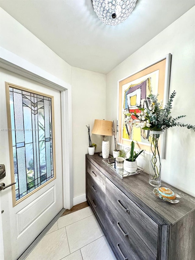 18830 NW 65th Ct, Hialeah, FL 33015 - doorway featuring light tile patterned floors and baseboards
