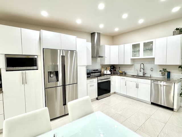 18830 NW 65th Ct, Hialeah, FL 33015 - kitchen featuring wall chimney range hood, appliances with stainless steel finishes, a sink, white cabinets, and recessed lighting