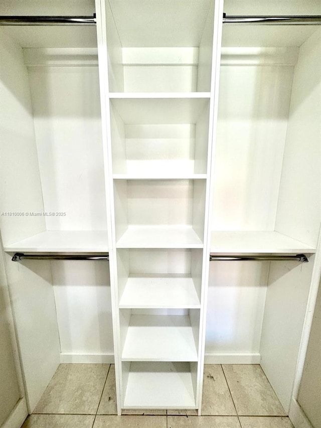 18830 NW 65th Ct, Hialeah, FL 33015 - spacious closet with tile patterned flooring