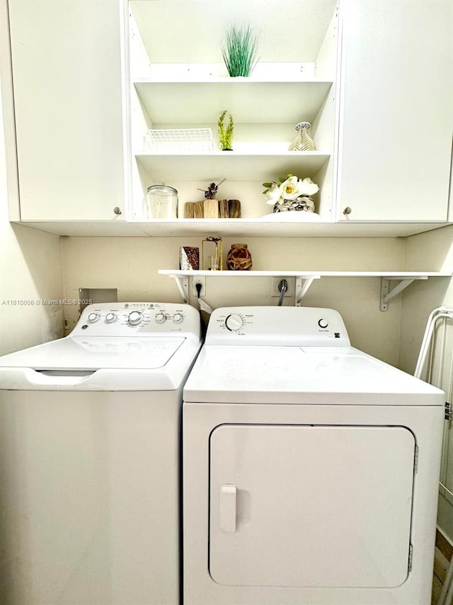 18830 NW 65th Ct, Hialeah, FL 33015 - laundry area with cabinet space and separate washer and dryer