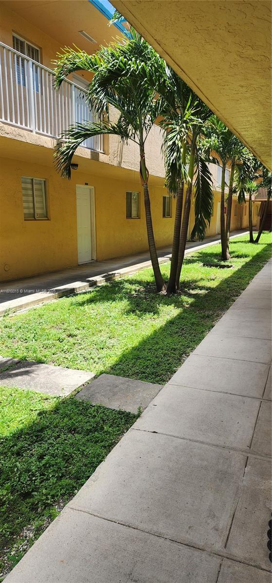 2985 W 80th St Unit 110, Hialeah, FL 33018 - view of grassy yard with a balcony