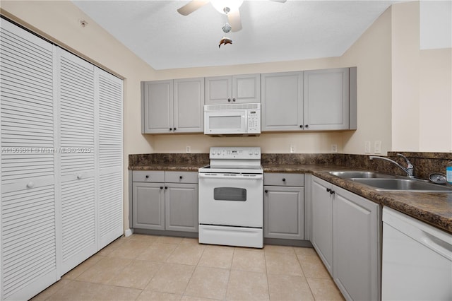 529 E Sheridan St Unit 206, Dania Beach, FL 33004 - kitchen with white appliances, gray cabinetry, a sink, dark countertops, and ceiling fan