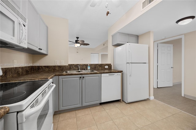529 E Sheridan St Unit 206, Dania Beach, FL 33004 - kitchen with white appliances, a ceiling fan, gray cabinets, and a sink