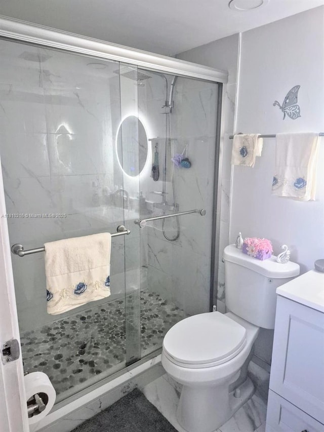 7320 NW 18th St Unit 204, Margate, FL 33063 - bathroom featuring vanity, marble finish floors, toilet, and a stall shower