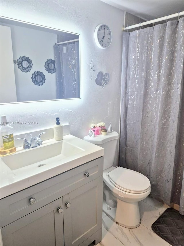 7320 NW 18th St Unit 204, Margate, FL 33063 - bathroom with marble look tiles, vanity, toilet, and curtained shower