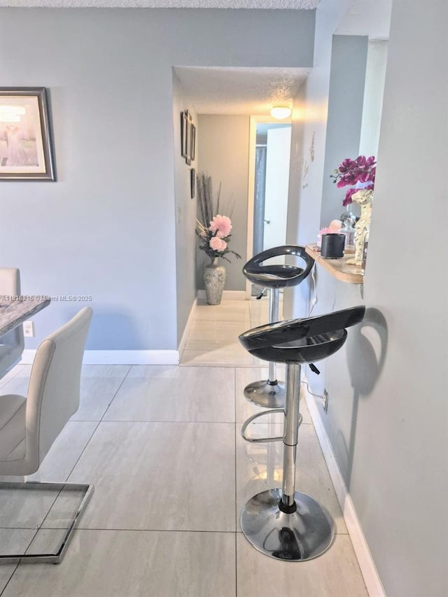 7320 NW 18th St Unit 204, Margate, FL 33063 - corridor featuring baseboards and tile patterned flooring