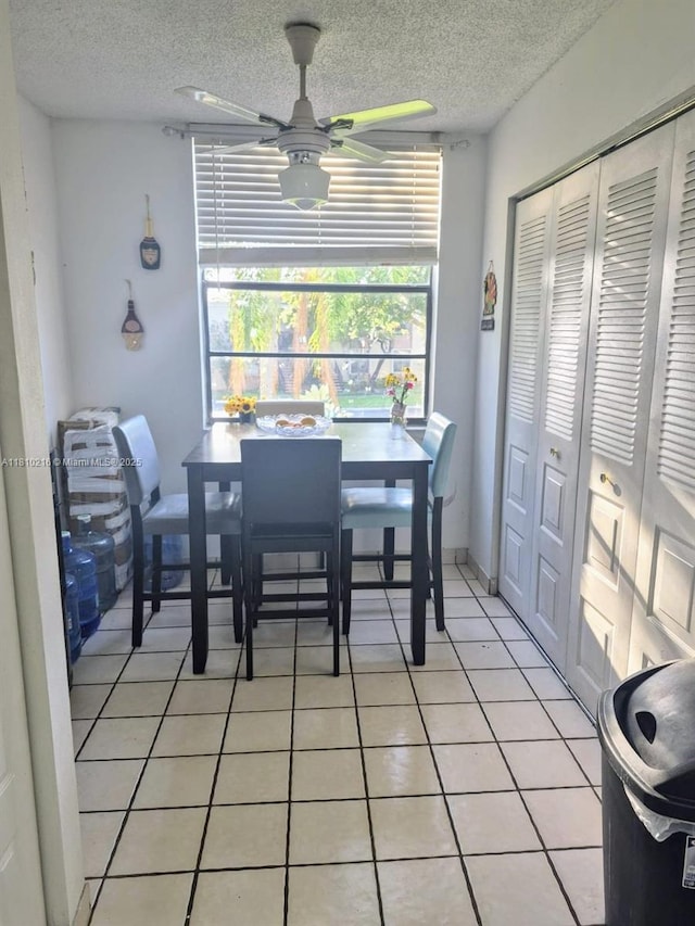 7320 NW 18th St Unit 204, Margate, FL 33063 - dining room featuring ceiling fan, a textured ceiling, and light tile patterned flooring