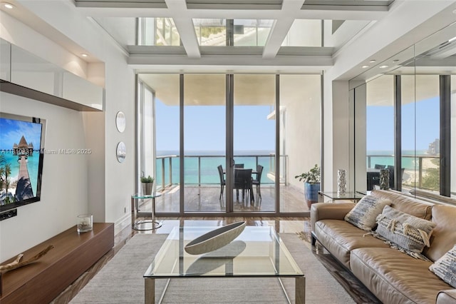 9703 Collins Ave Unit 2615, Bal Harbour, FL 33154 - living area featuring a water view, coffered ceiling, wood finished floors, beam ceiling, and expansive windows