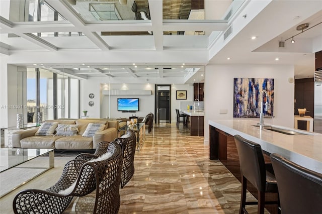9703 Collins Ave Unit 2615, Bal Harbour, FL 33154 - living room featuring light marble finish flooring, coffered ceiling, recessed lighting, and beam ceiling
