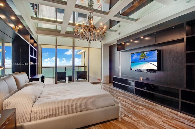 9703 Collins Ave Unit 2615, Bal Harbour, FL 33154 - bedroom with a chandelier, multiple windows, and coffered ceiling