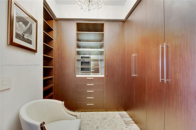 9703 Collins Ave Unit 2615, Bal Harbour, FL 33154 - walk in closet featuring a chandelier