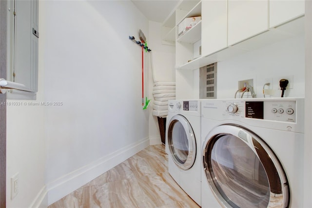 9703 Collins Ave Unit 2615, Bal Harbour, FL 33154 - laundry room with washer and clothes dryer, cabinet space, baseboards, and light marble finish floors