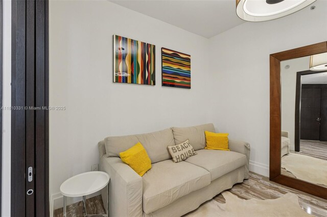 9703 Collins Ave Unit 2615, Bal Harbour, FL 33154 - living area with wood finished floors and baseboards