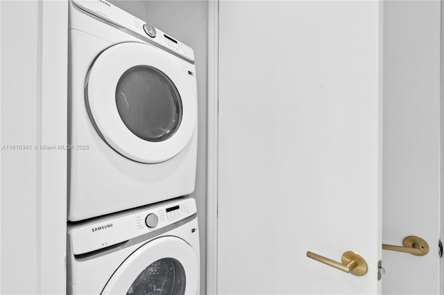 2655 S Bayshore Dr Unit 705, Miami, FL 33133 - washroom featuring stacked washer / dryer
