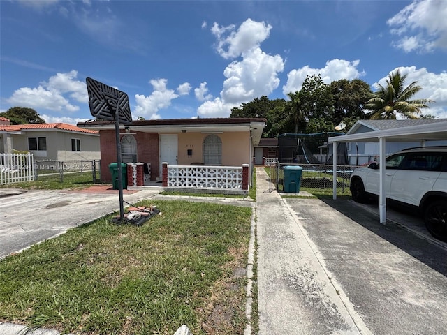 5131 NW 4th St, Miami, FL 33126 - view of front of home featuring a porch and stucco siding