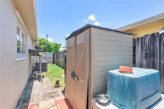 5829 Taylor St, Hollywood, FL 33021 - view of outdoor structure with central AC and a fenced backyard