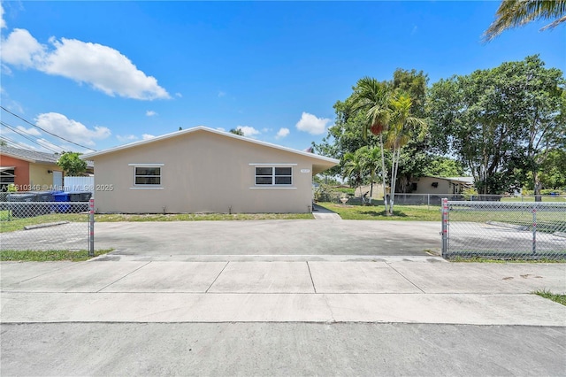 5829 Taylor St, Hollywood, FL 33021 - view of home's exterior with stucco siding and driveway
