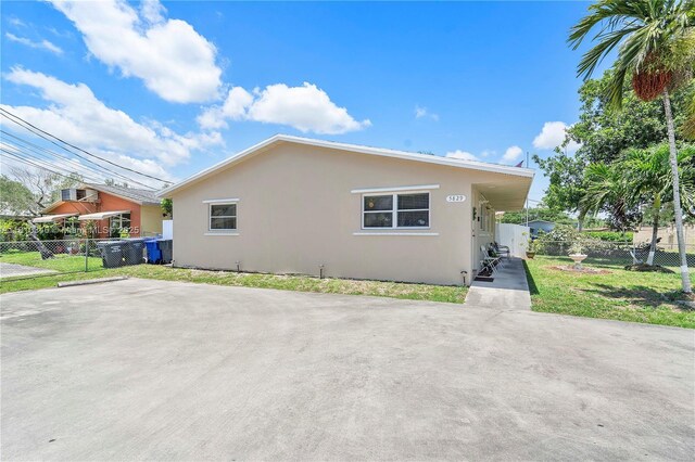 5829 Taylor St, Hollywood, FL 33021 - view of home's exterior featuring stucco siding