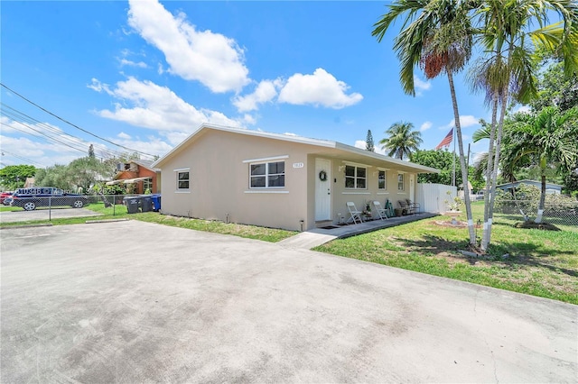 5829 Taylor St, Hollywood, FL 33021 - view of front of property with stucco siding and a patio