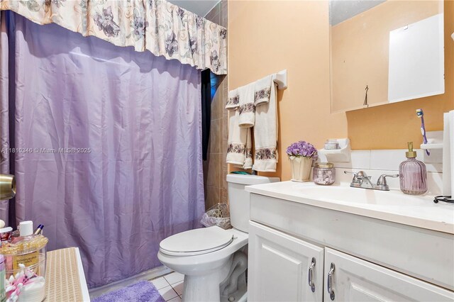 5829 Taylor St, Hollywood, FL 33021 - full bathroom featuring vanity, toilet, tile patterned floors, and shower / bath combo with shower curtain