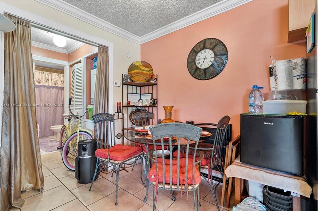 5829 Taylor St, Hollywood, FL 33021 - tiled dining room featuring crown molding and a textured ceiling
