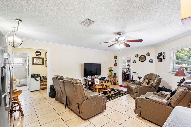 5829 Taylor St, Hollywood, FL 33021 - living room with light tile patterned floors, ornamental molding, a ceiling fan, a textured ceiling, and a chandelier