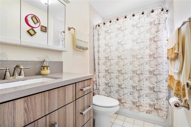 5829 Taylor St, Hollywood, FL 33021 - bathroom with toilet, tile patterned floors, vanity, and shower / bathtub combination with curtain