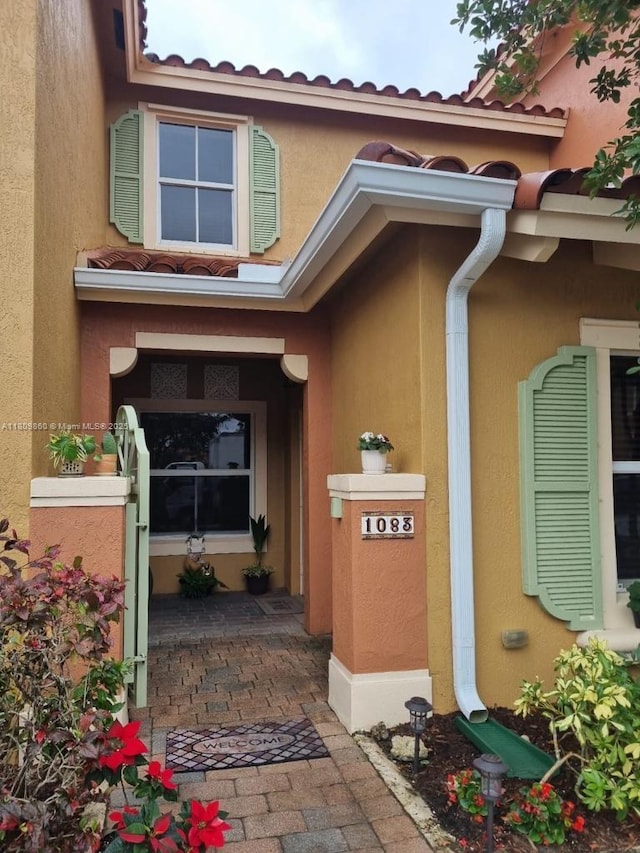 1083 SW 143rd Ave Unit 1206, Pembroke Pines, FL 33027 - view of exterior entry with stucco siding