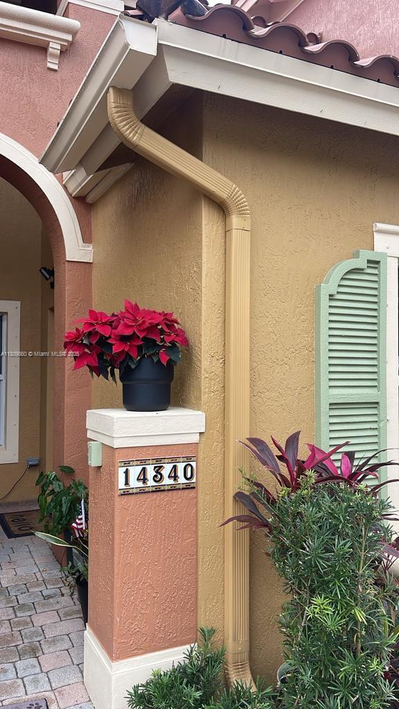 1083 SW 143rd Ave Unit 1206, Pembroke Pines, FL 33027 - view of home's exterior with stucco siding