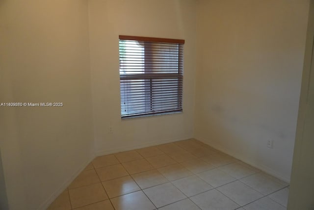 1083 SW 143rd Ave Unit 1206, Pembroke Pines, FL 33027 - empty room with light tile patterned floors and baseboards