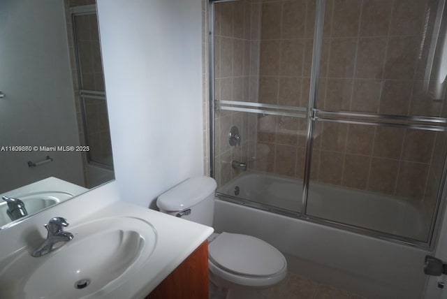 1083 SW 143rd Ave Unit 1206, Pembroke Pines, FL 33027 - full bathroom featuring vanity, toilet, bath / shower combo with glass door, and tile patterned flooring